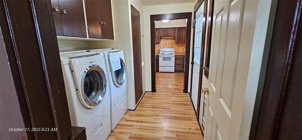 407 Pecan Street Clyde, TX 79510 - Photo 30 of 40 a view of a hallway with washer and dryer