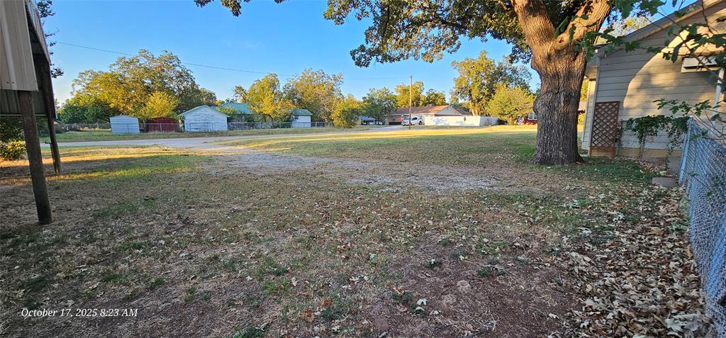 407 Pecan Street Clyde, TX 79510 - Photo 32 of 40 a view of a yard with an tree