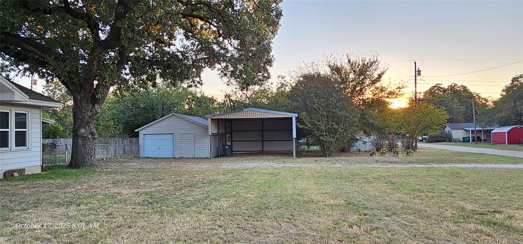 407 Pecan Street Clyde, TX 79510 - Photo 37 of 40 a house with trees in front of it