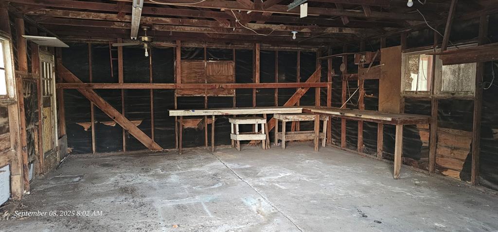 407 Pecan Street Clyde, TX 79510 - Photo 39 of 40 a view of a big room with wooden floor and windows
