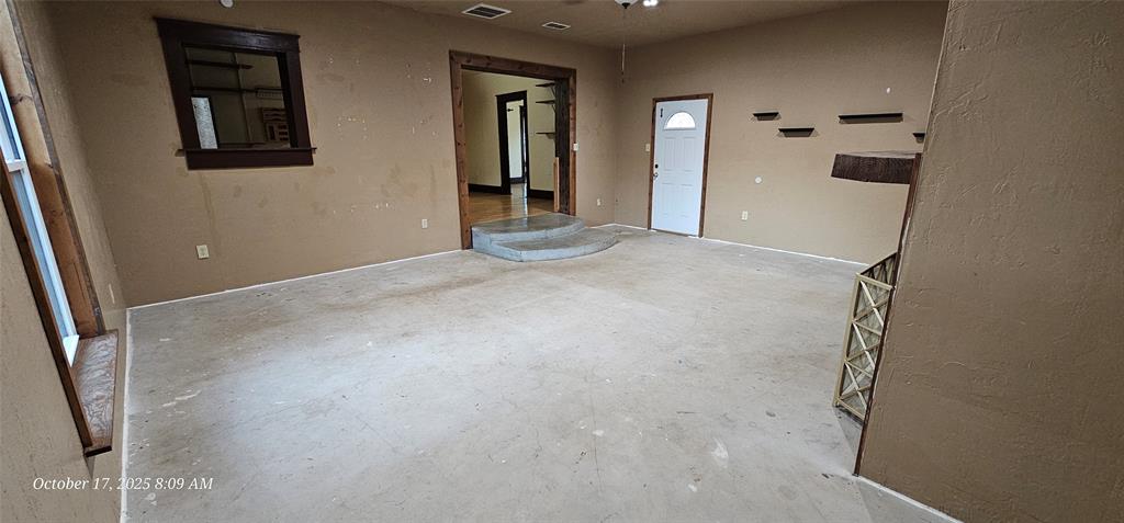 407 Pecan Street Clyde, TX 79510 - Photo 9 of 40 an empty room with windows
