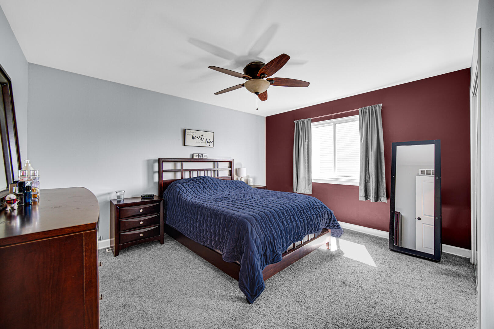 3113 Devonshire Circle Crown Point, IN 46307 - Photo 8 of 18 a bedroom with a bed and a chandelier