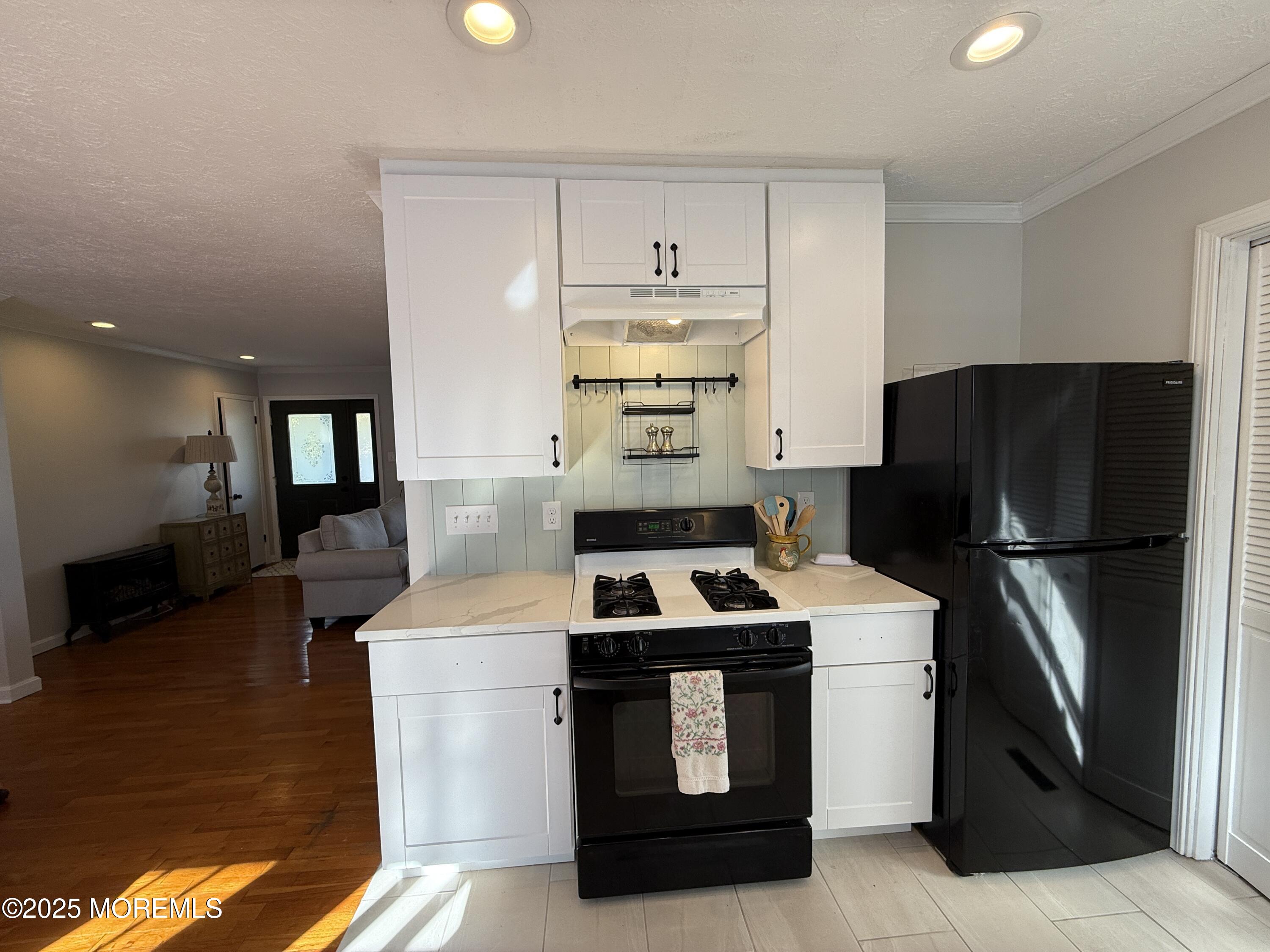 220 B Center Street Tuckerton, NJ 08087 - Photo 16 of 54 a kitchen with a refrigerator and a stove top oven