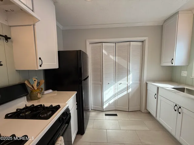 a kitchen with a stove and a refrigerator