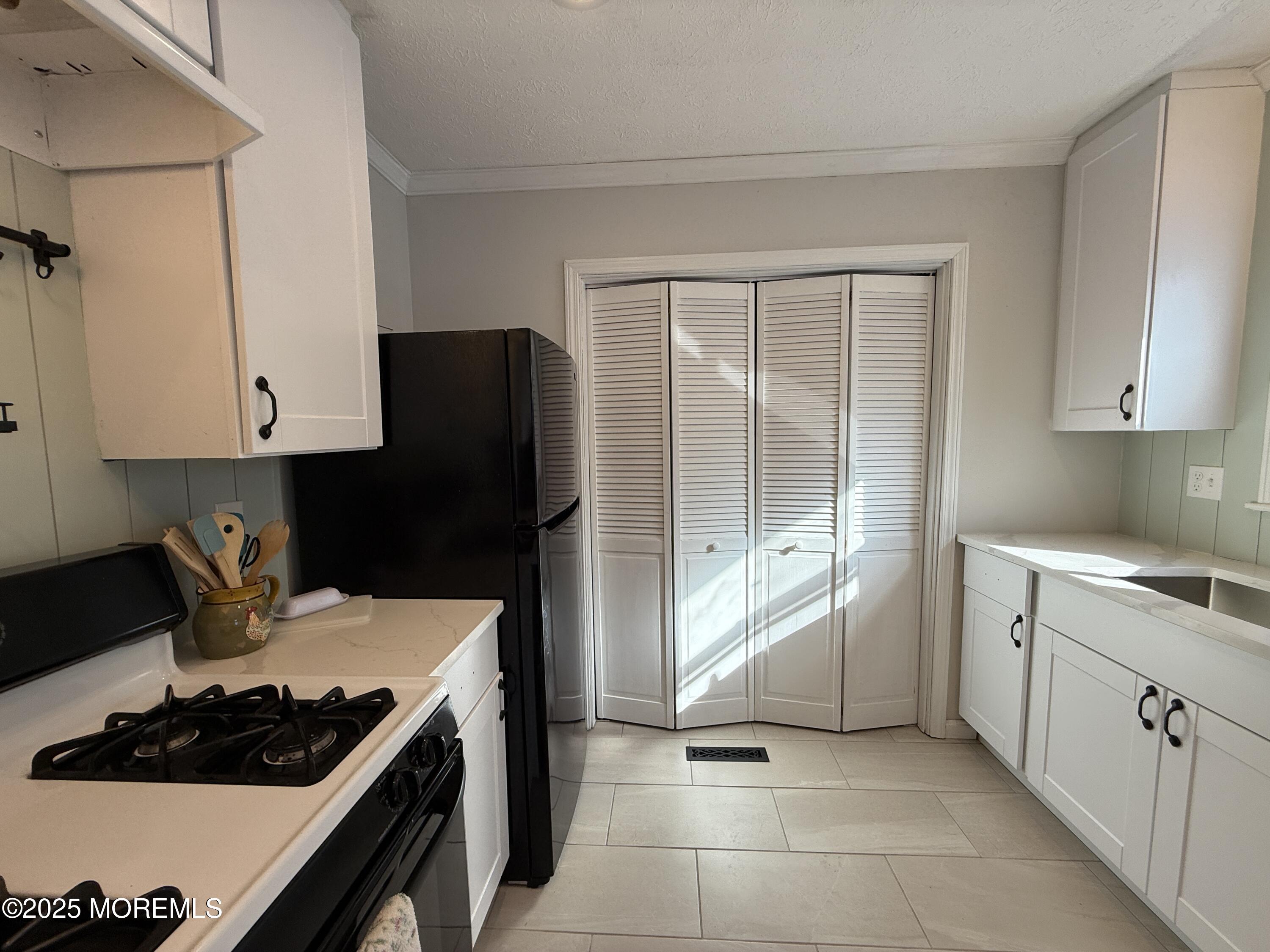 220 B Center Street Tuckerton, NJ 08087 - Photo 17 of 54 a kitchen with a stove and a refrigerator