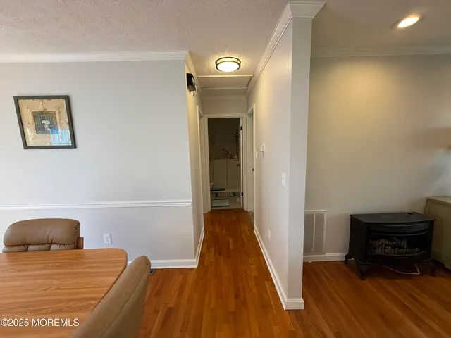 a view of bedroom with wooden floor