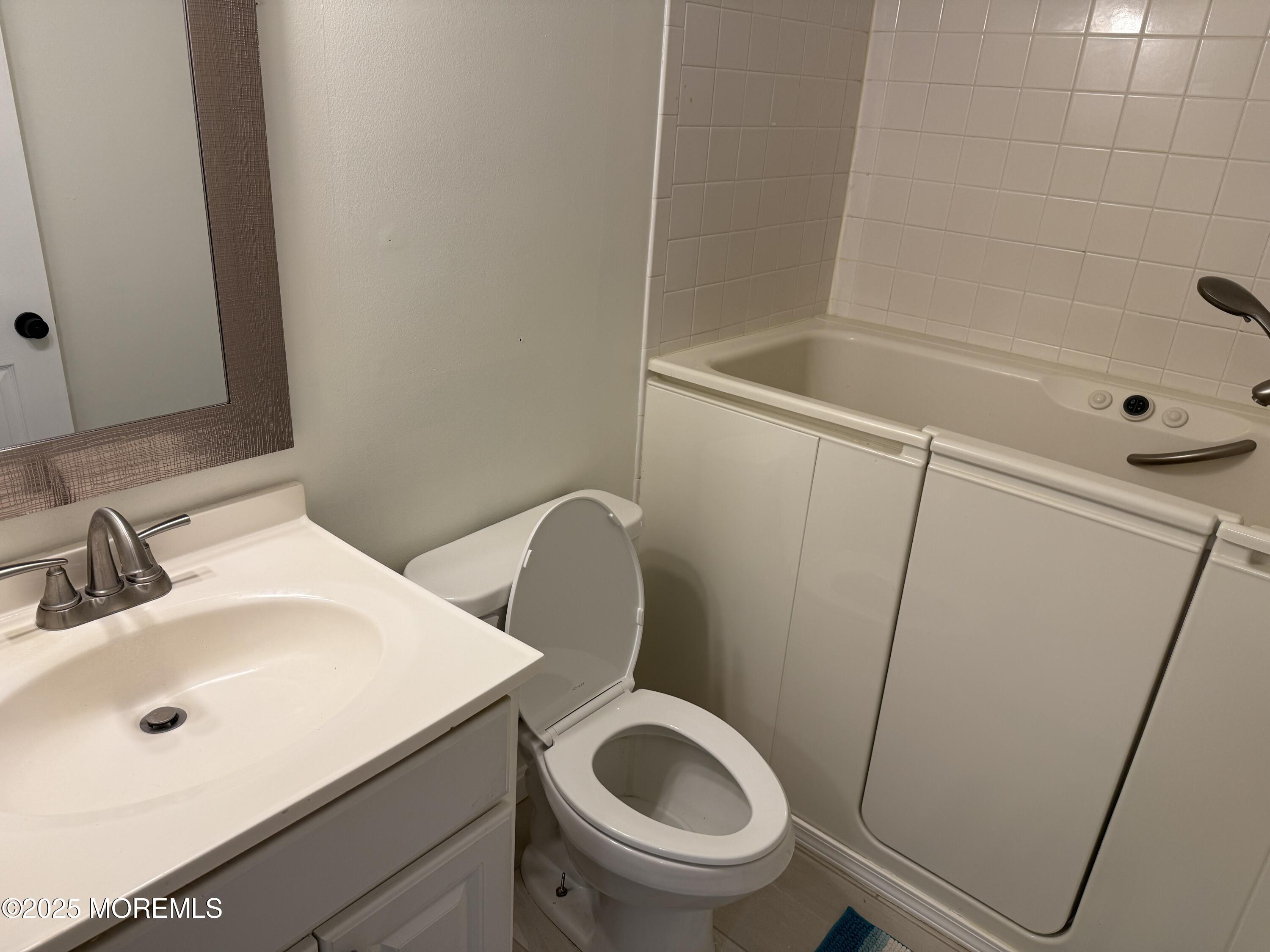 220 B Center Street Tuckerton, NJ 08087 - Photo 30 of 54 a bathroom with a sink a toilet and shower