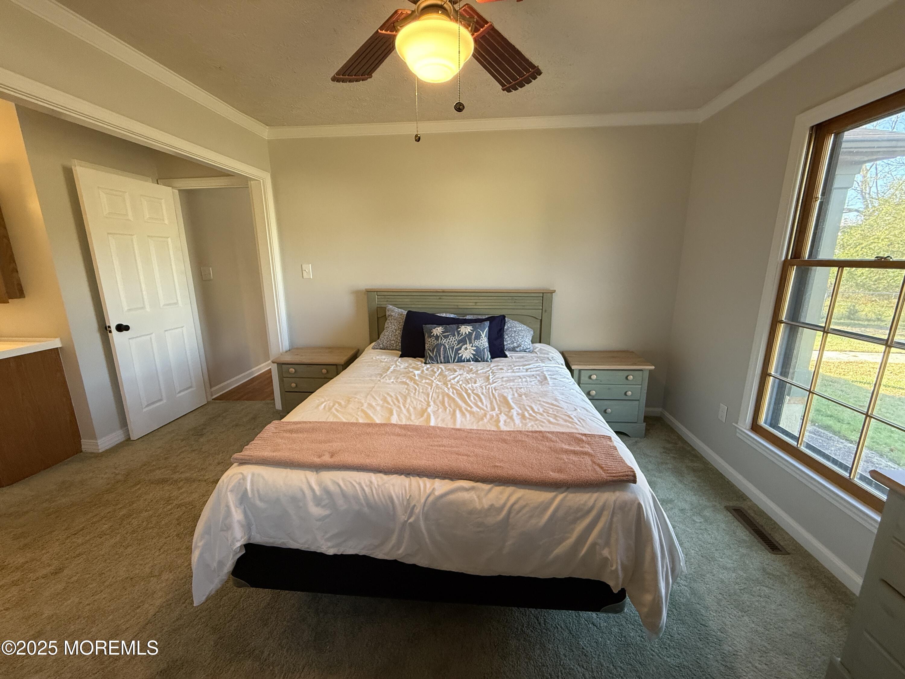 220 B Center Street Tuckerton, NJ 08087 - Photo 35 of 54 a bedroom with a bed and a large window