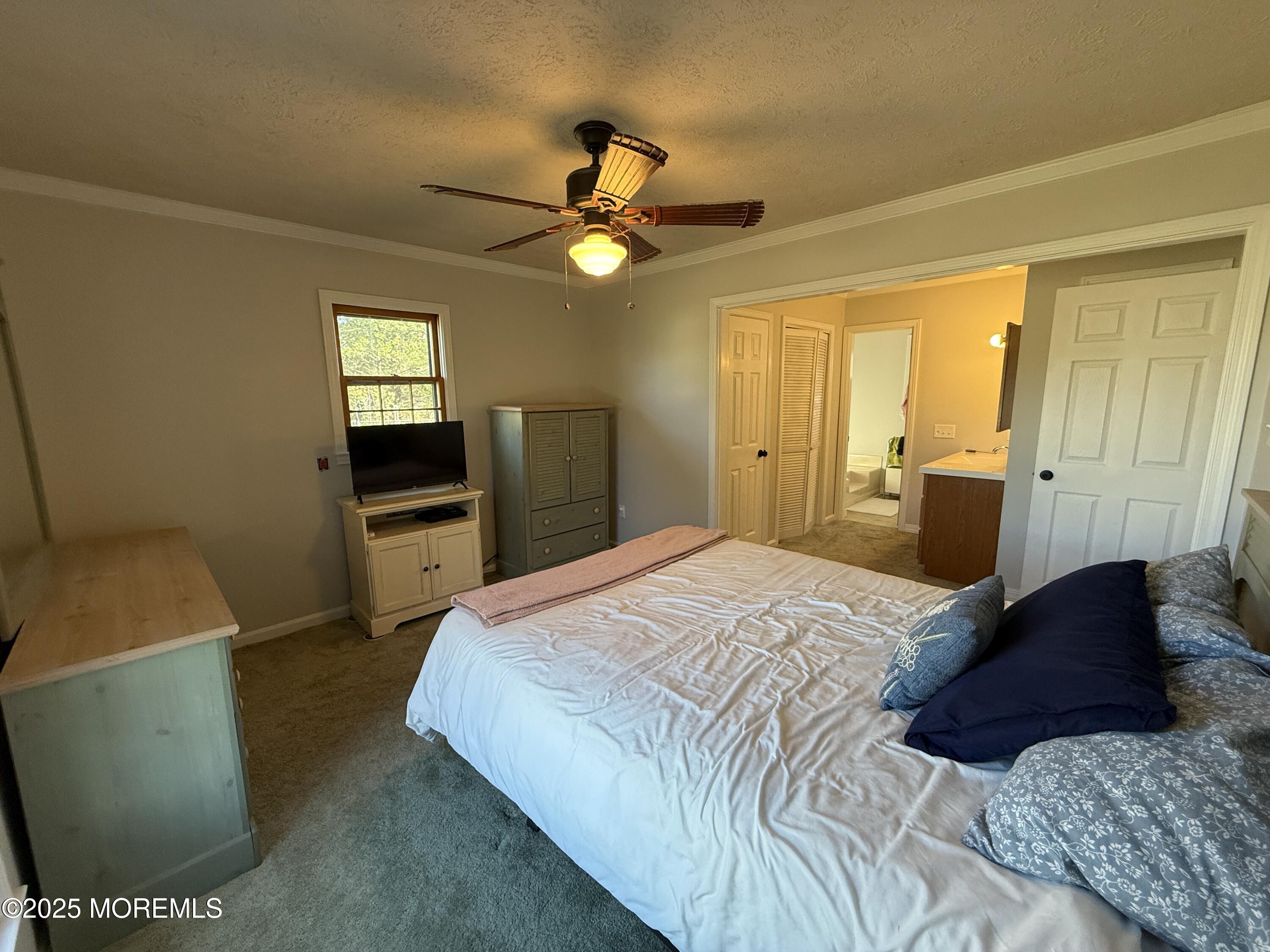220 B Center Street Tuckerton, NJ 08087 - Photo 36 of 54 a bedroom with a bed and a sink