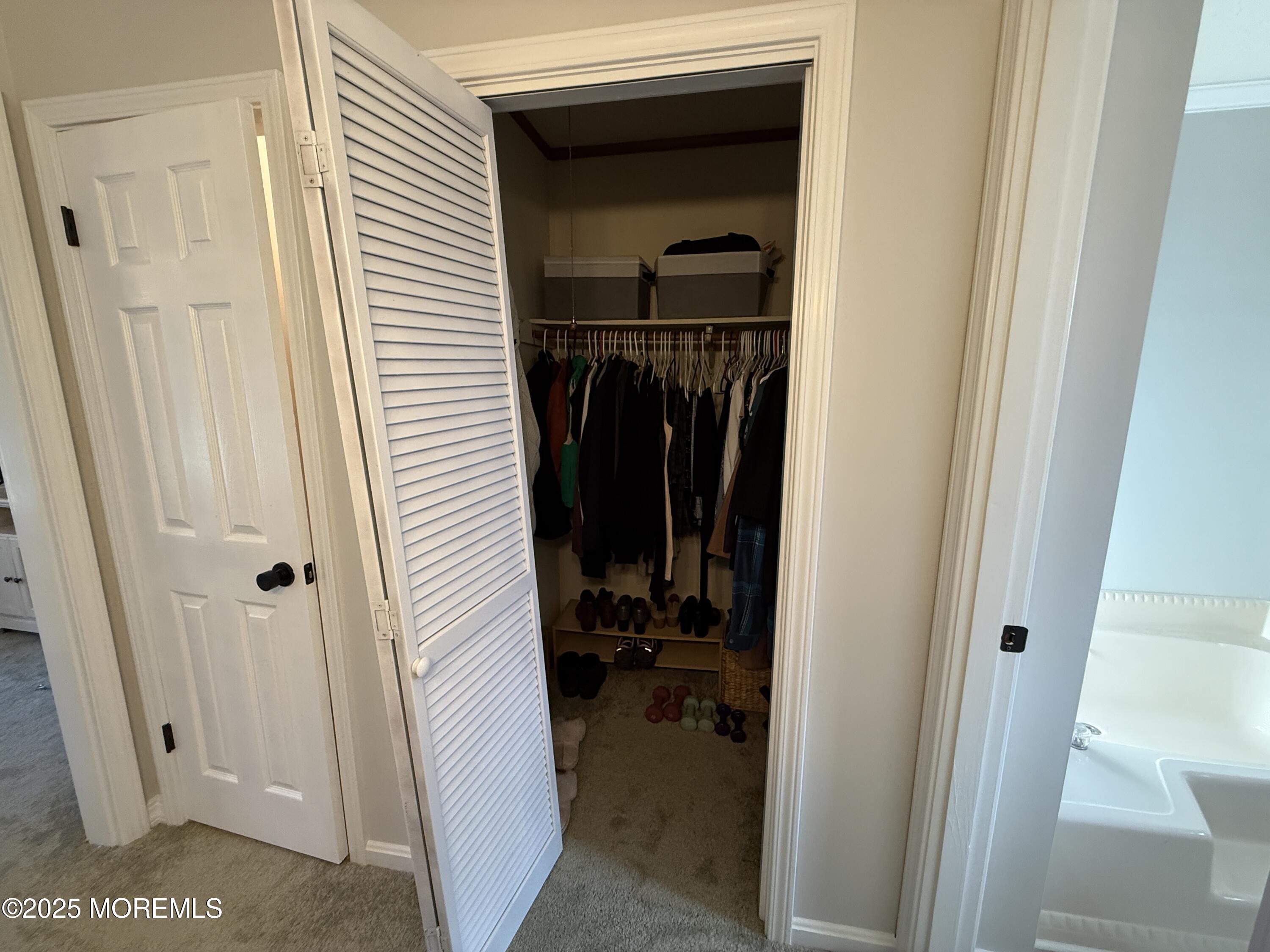 220 B Center Street Tuckerton, NJ 08087 - Photo 37 of 54 a view of a hallway with closet and wooden door