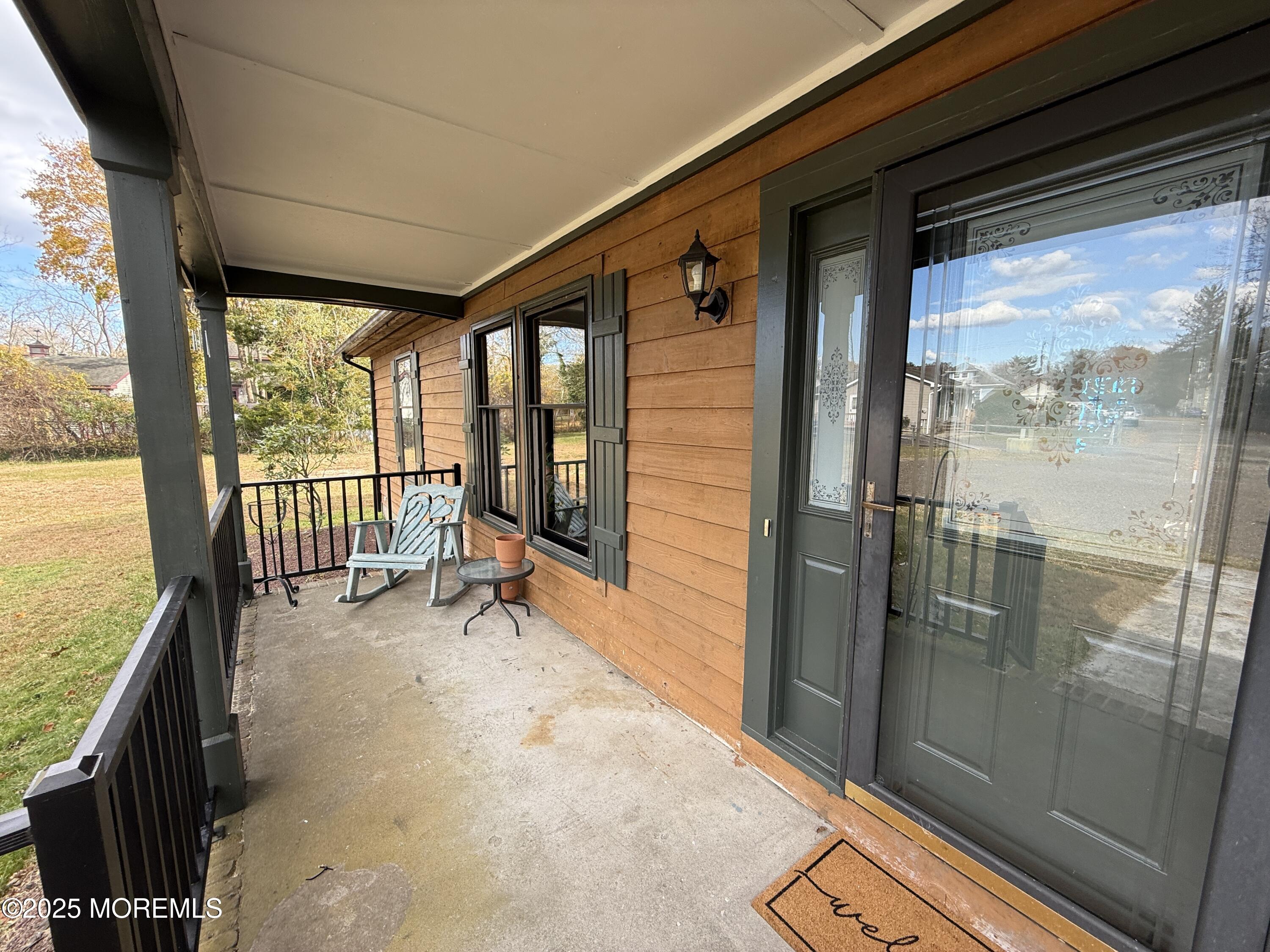 220 B Center Street Tuckerton, NJ 08087 - Photo 4 of 54 a view of a porch with a table and chairs