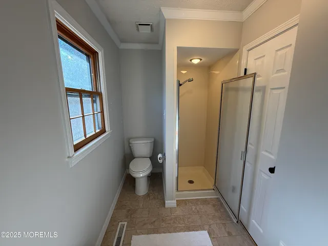 a bathroom with a tub and shower