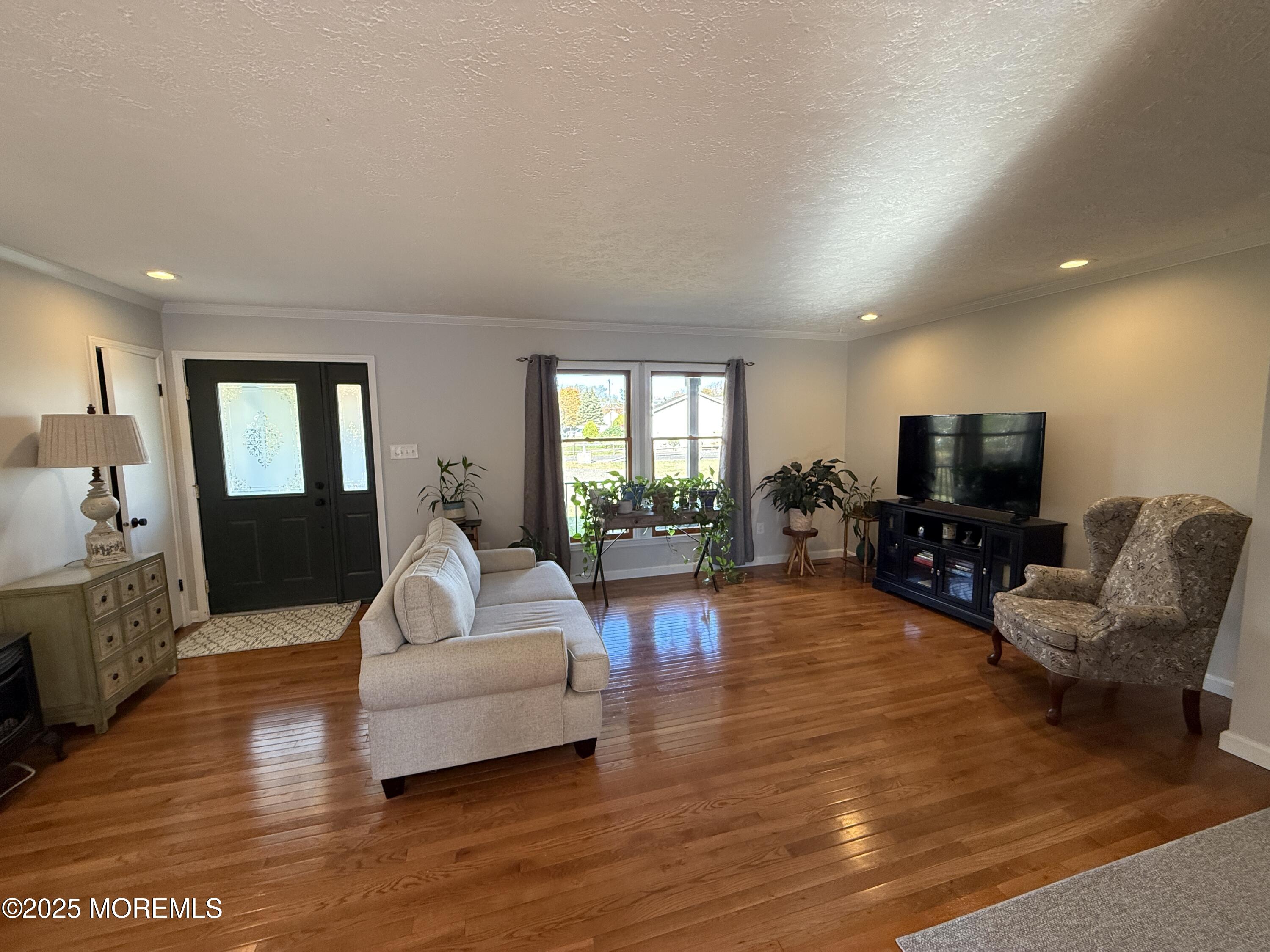 220 B Center Street Tuckerton, NJ 08087 - Photo 7 of 54 a living room with furniture and a flat screen tv