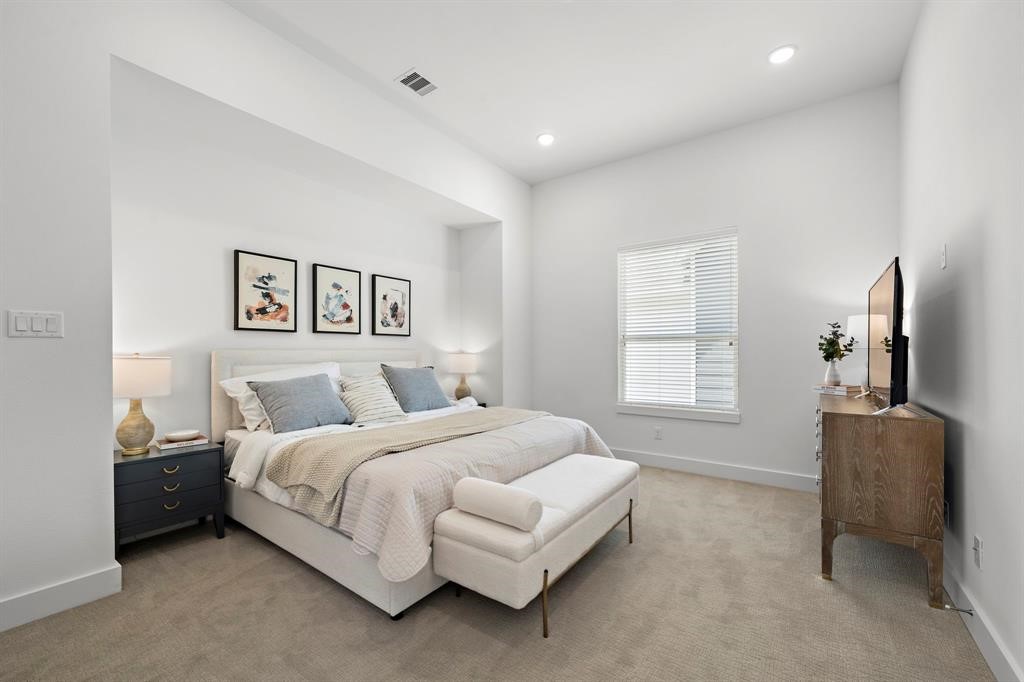 1586 West Tidwell Road Houston, TX 77091 - Photo 9 of 14 a bedroom with a bed and couch