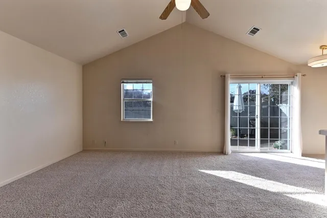 a view of empty room with windows