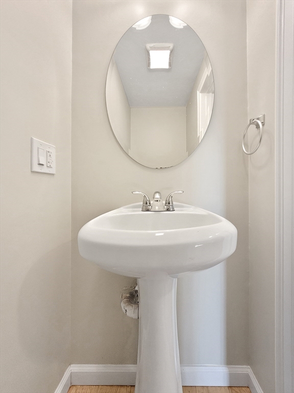 26 Arcadia Street, Unit 1R Boston, MA 02122 - Photo 6 of 7 a bathroom with a sink and mirror