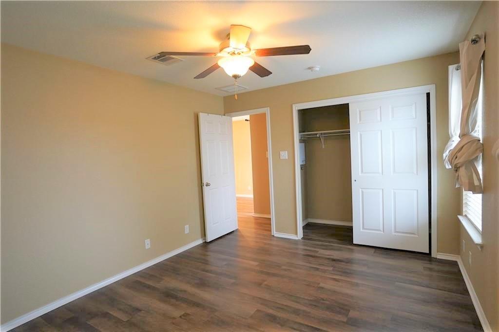 201 Edwin Kyle, TX 78640 - Photo 11 of 21 an empty room with wooden floor and a ceiling fan