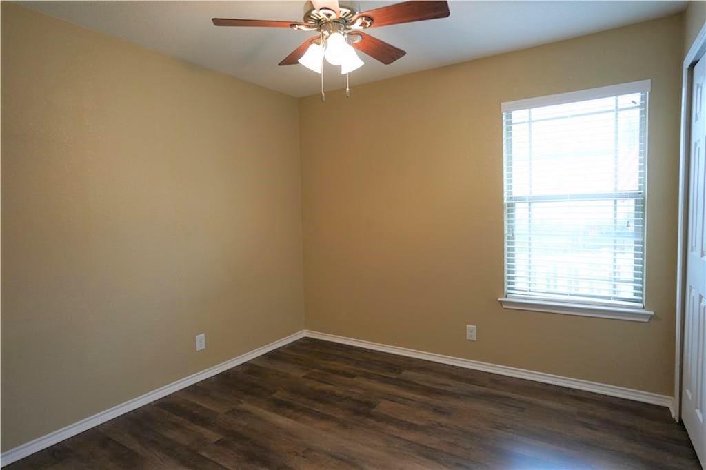201 Edwin Kyle, TX 78640 - Photo 14 of 21 an empty room with wooden floor and windows