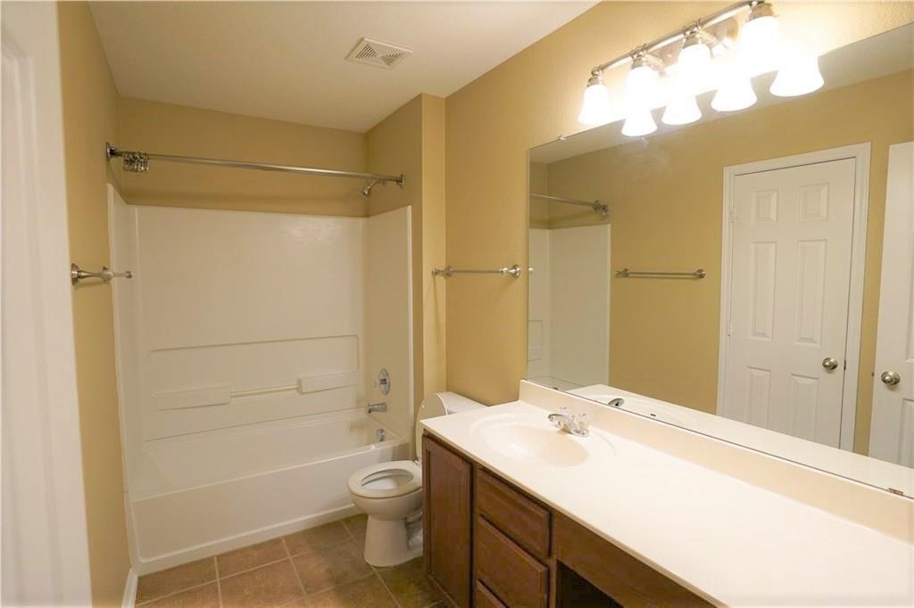 201 Edwin Kyle, TX 78640 - Photo 15 of 21 a bathroom with a sink a toilet and shower