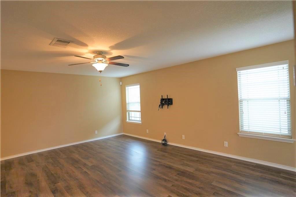 201 Edwin Kyle, TX 78640 - Photo 5 of 21 an empty room with wooden floor and windows