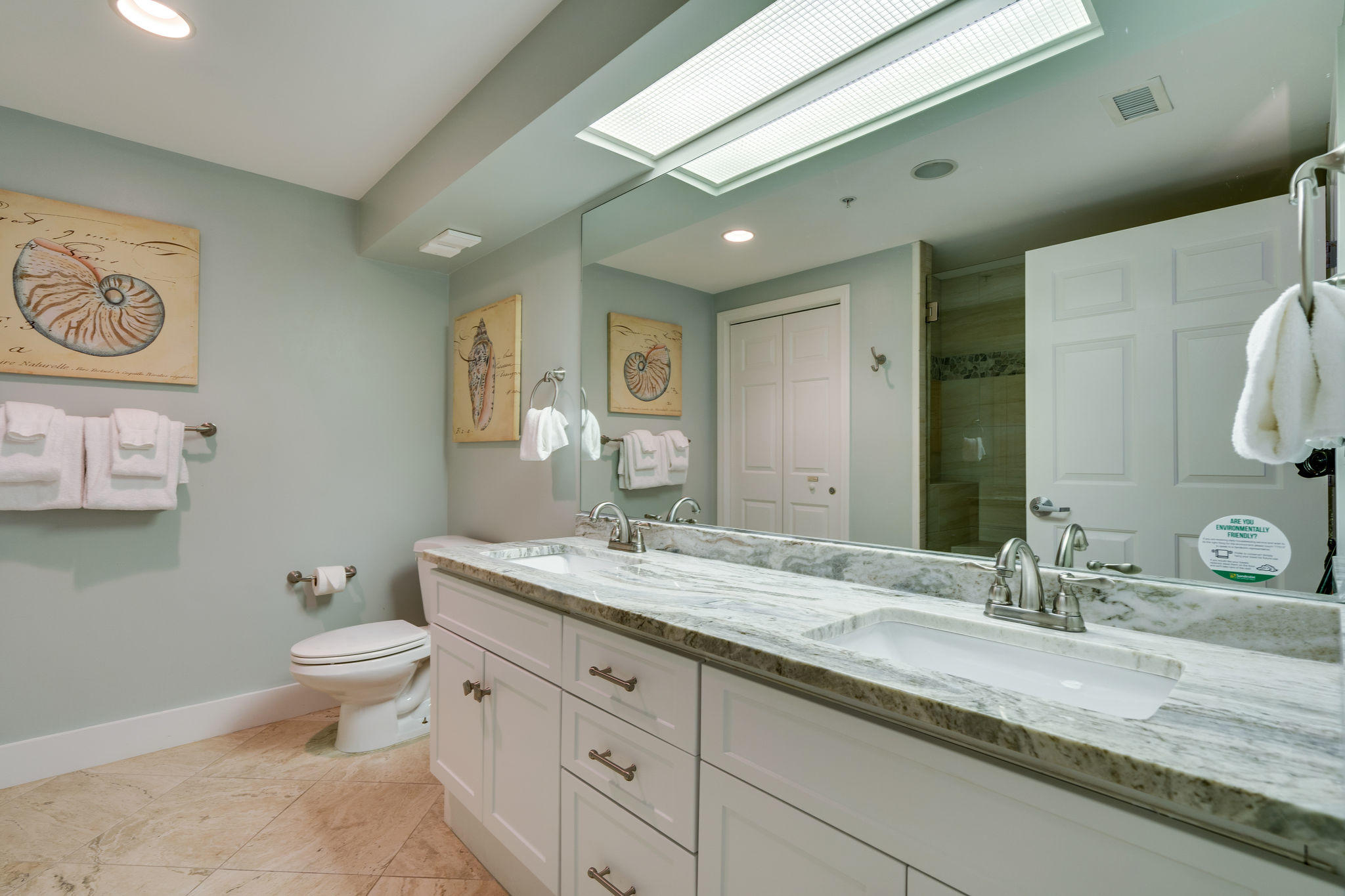 4807 Westwinds Drive, Unit 4807 Miramar Beach, FL 32550 - Photo 11 of 19 a bathroom with a granite countertop toilet sink and mirror