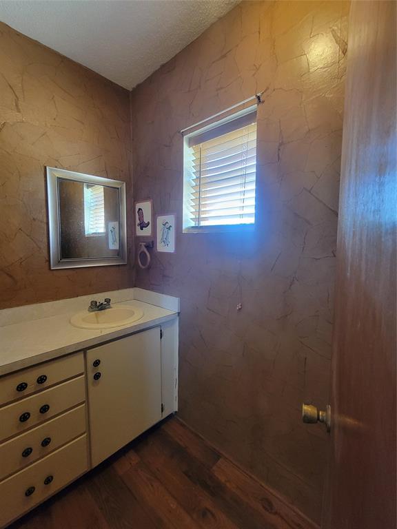 215 Cedar Court Graham, TX 76450 - Photo 15 of 39 a view of a bathroom with 2 sink and a bathtub