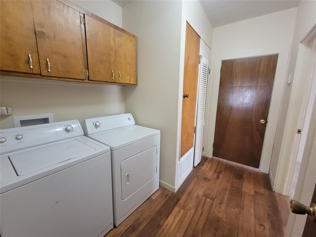 215 Cedar Court Graham, TX 76450 - Photo 24 of 39 a view of utility room with washer and dryer