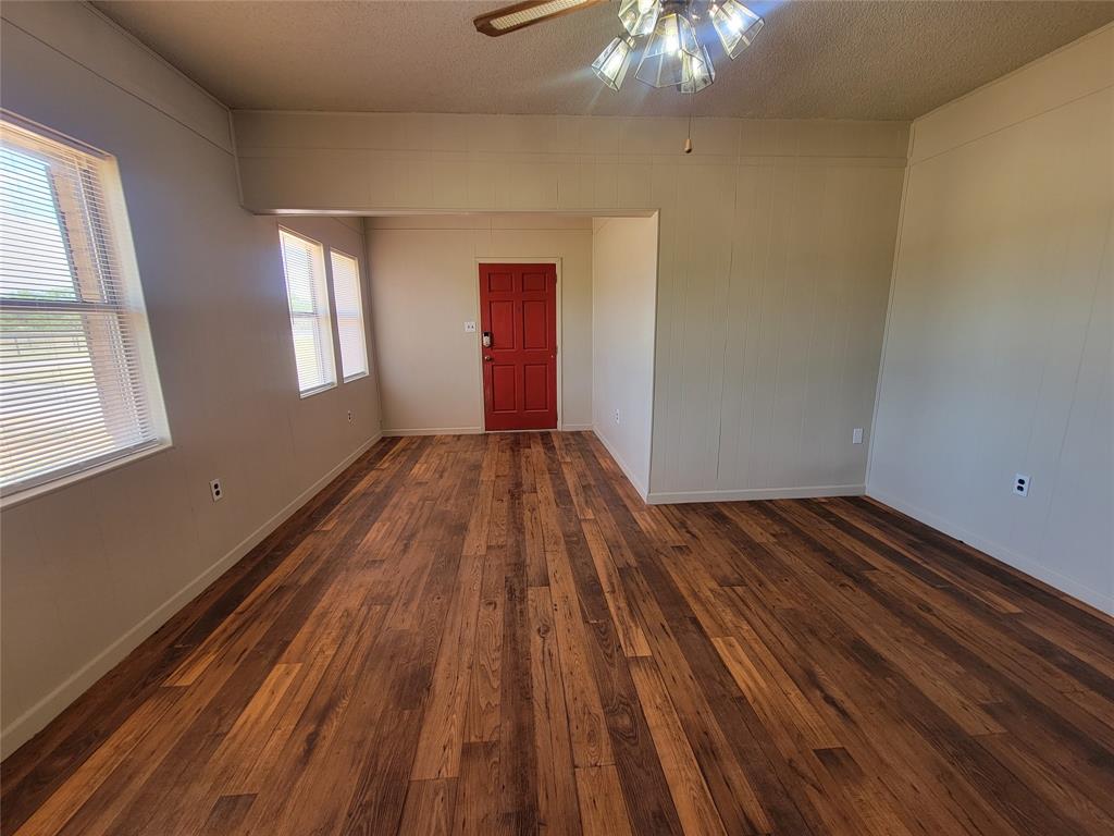 215 Cedar Court Graham, TX 76450 - Photo 35 of 39 a view of wooden floor in an empty room