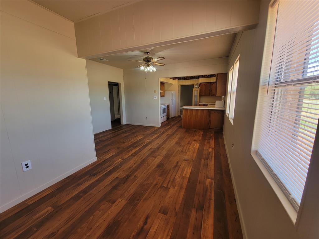 215 Cedar Court Graham, TX 76450 - Photo 36 of 39 a view of a room with wooden floor and window