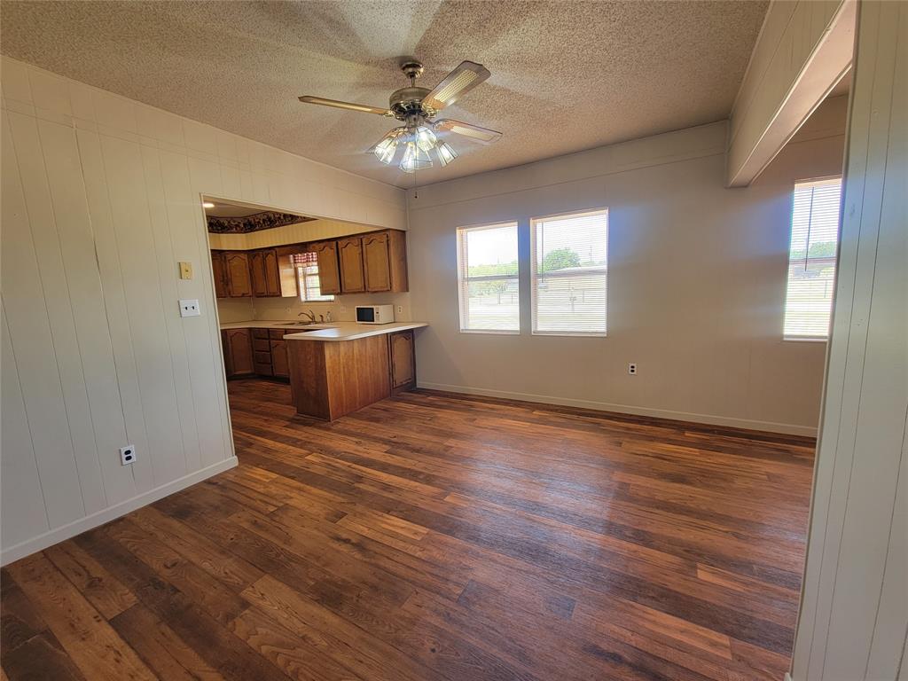 215 Cedar Court Graham, TX 76450 - Photo 37 of 39 wooden floor in an empty room with a window