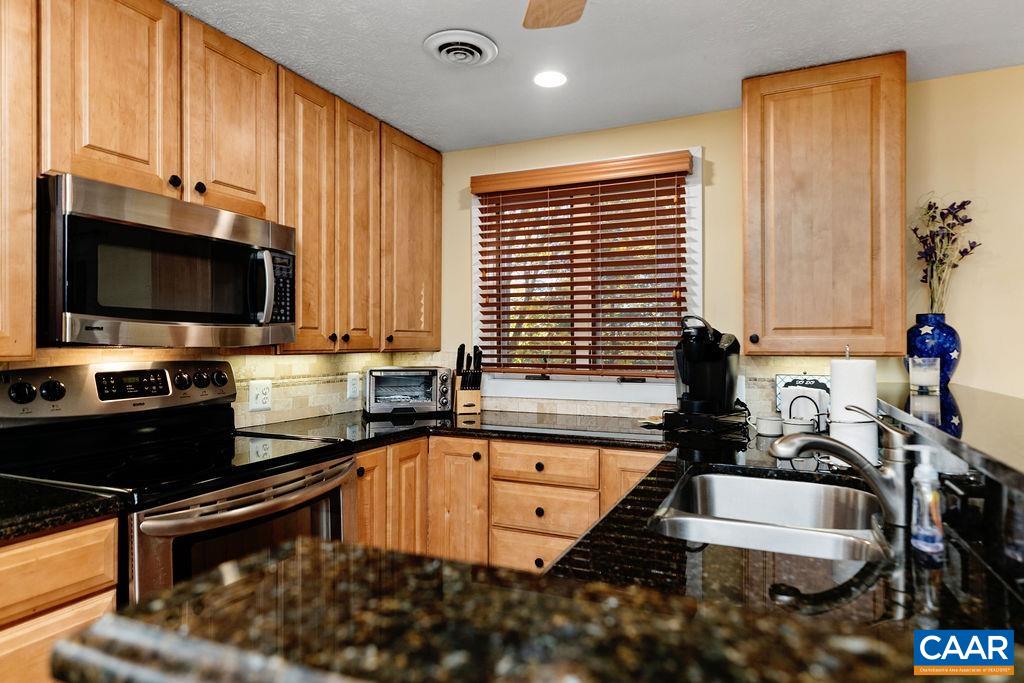 411 Three Ridges Roseland, VA 22967 - Photo 11 of 27 a kitchen with a sink appliances and cabinets