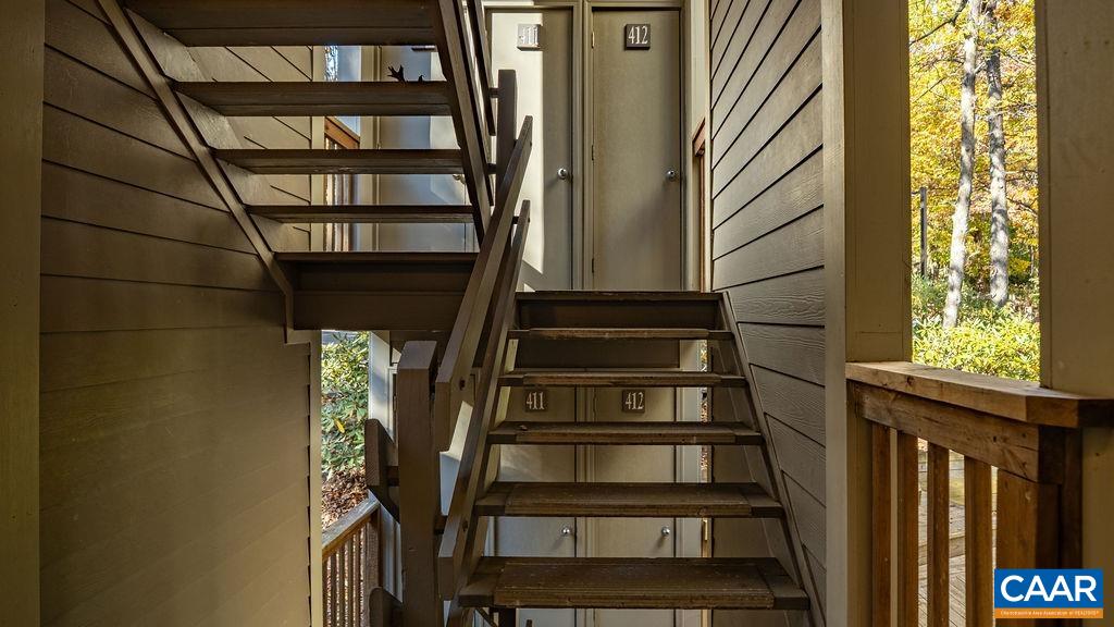 411 Three Ridges Roseland, VA 22967 - Photo 25 of 27 a view of staircase with wooden floor and white walls