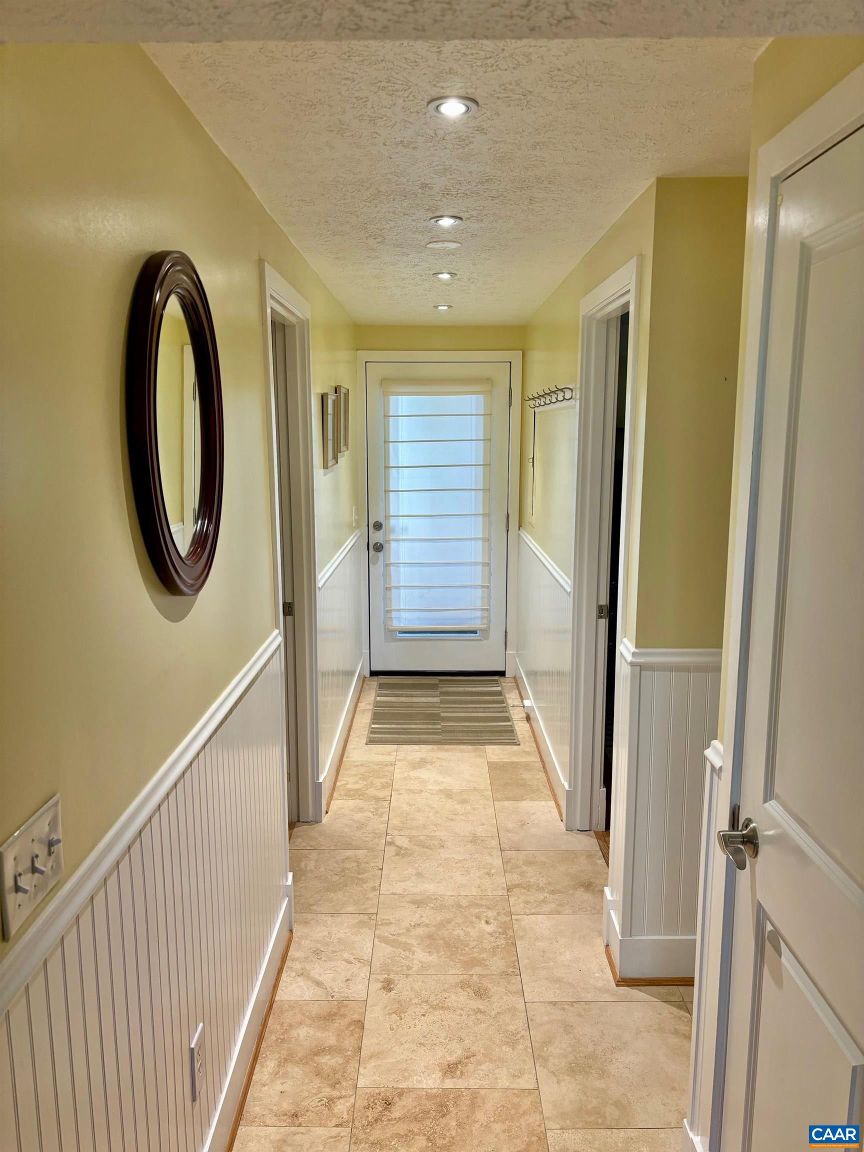 411 Three Ridges Roseland, VA 22967 - Photo 3 of 27 a view of a hallway with wooden floor and staircase