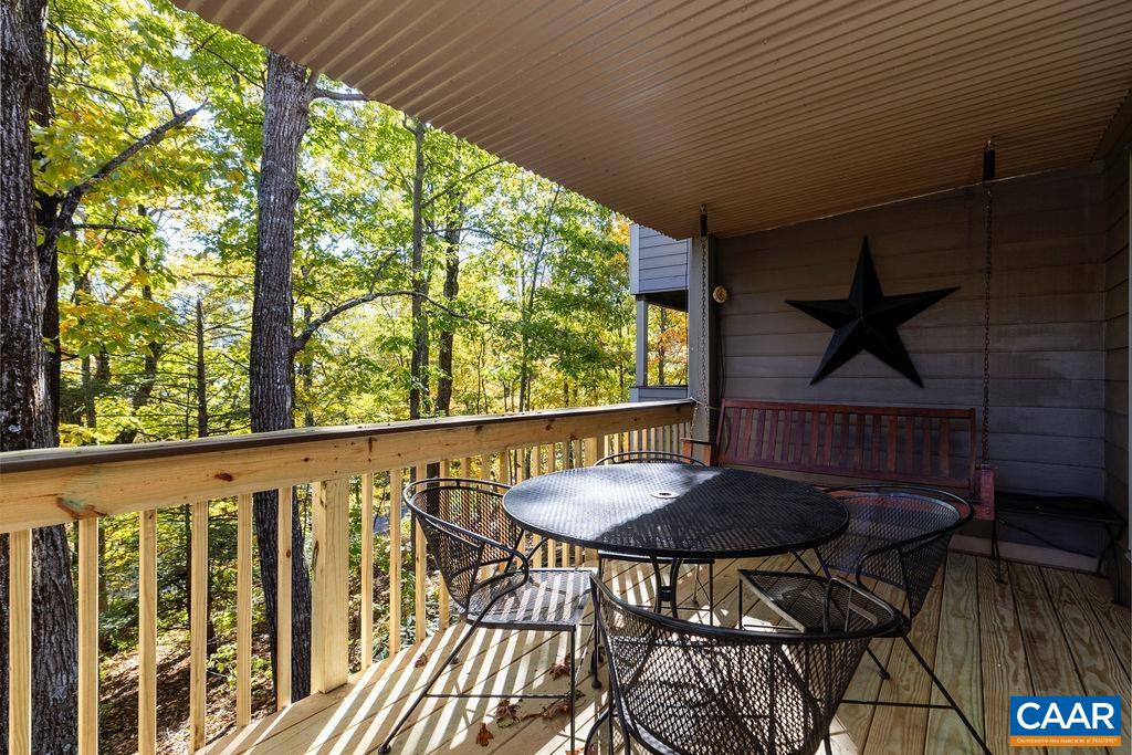 411 Three Ridges Roseland, VA 22967 - Photo 7 of 27 a view of a balcony furniture and wooden floor