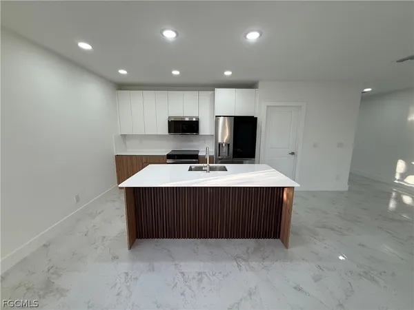 a kitchen with a cabinets and a sink