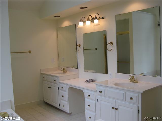 10830 Cherokee Road Midlothian, VA 23113 - Photo 17 of 17 a bathroom with a double vanity sink mirror and double