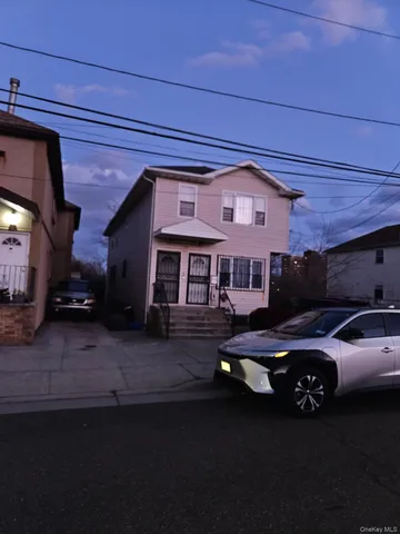 a front view of a house with parking space