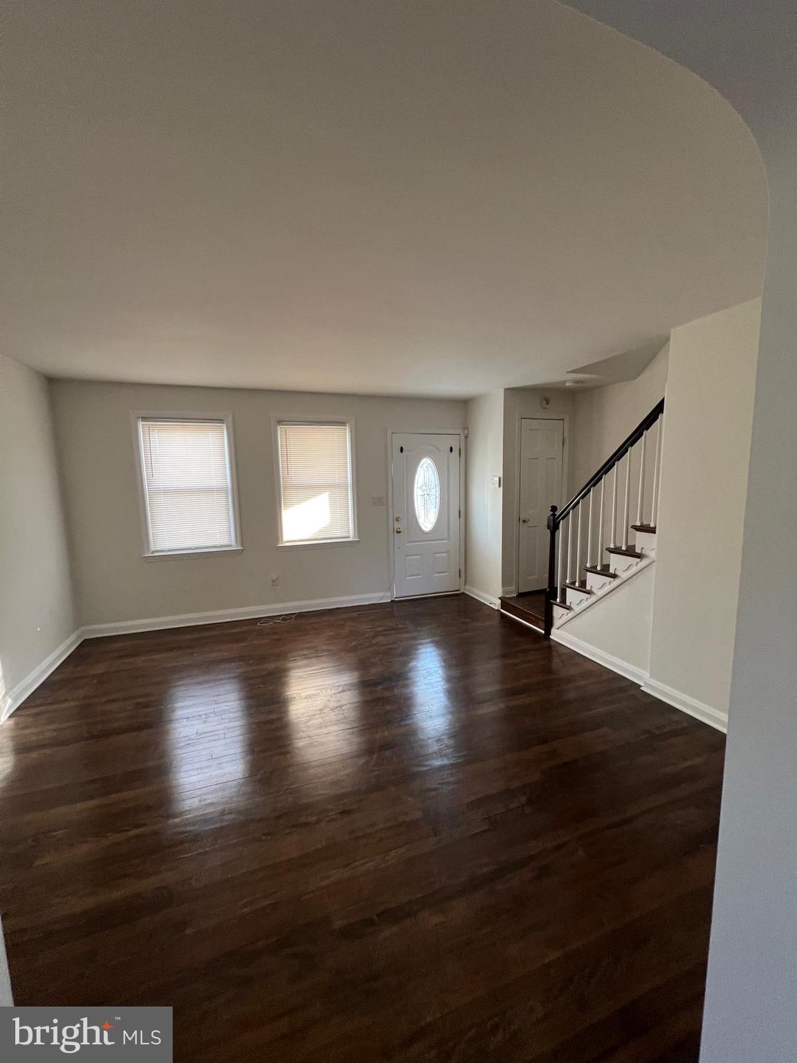 603 Braeside Road Baltimore, MD 21229 - Photo 14 of 30 a view of wooden floor and windows in a room
