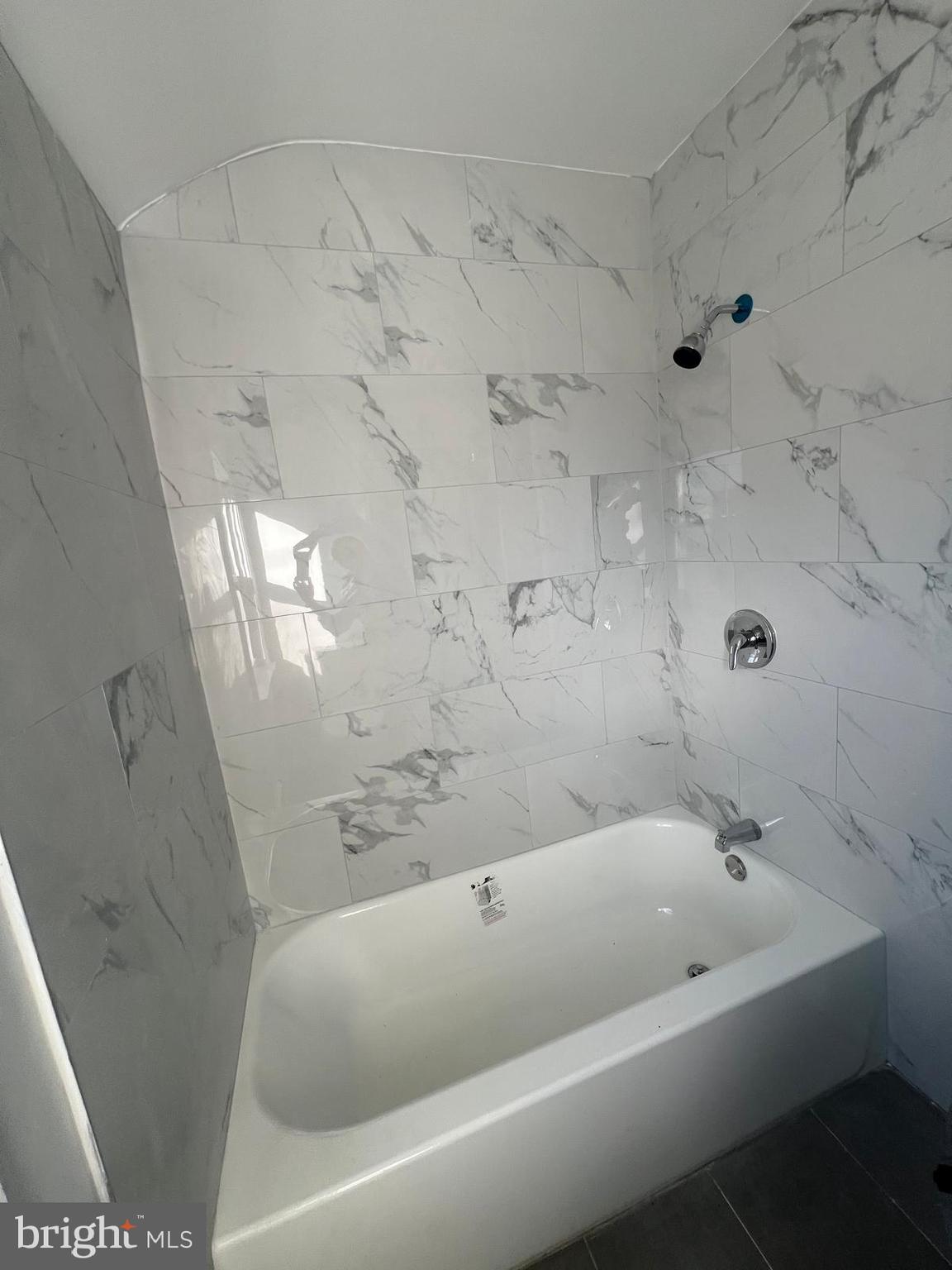 603 Braeside Road Baltimore, MD 21229 - Photo 20 of 30 a bathroom with bathtub and shower