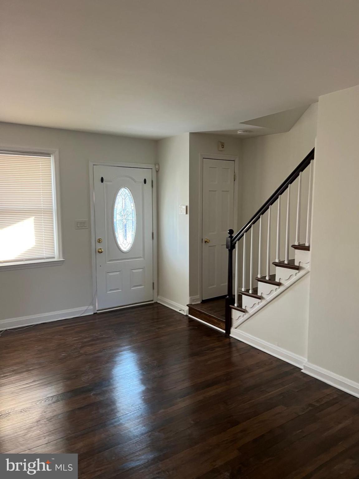603 Braeside Road Baltimore, MD 21229 - Photo 23 of 30 a view of an empty room with wooden floor and a window