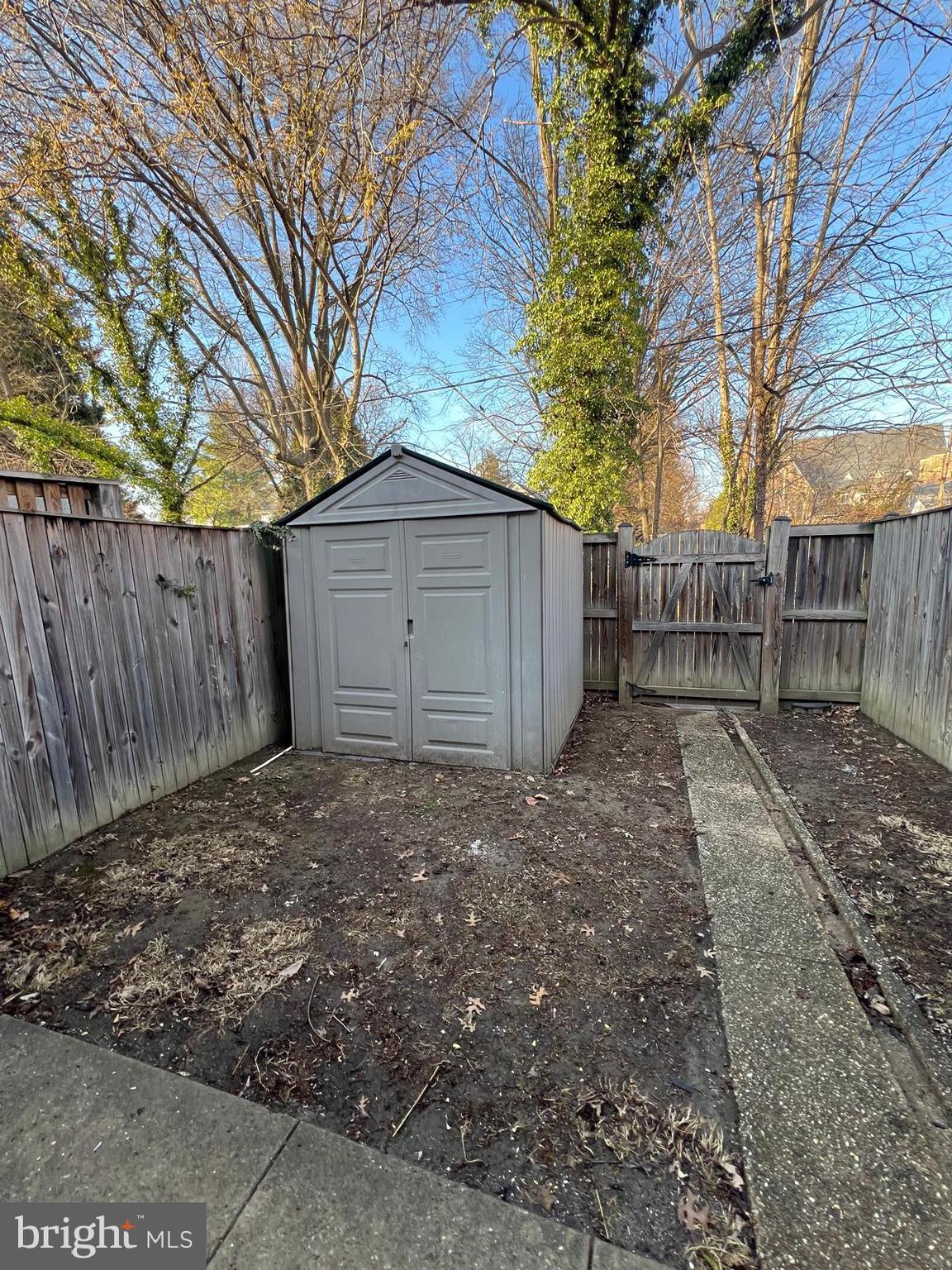 603 Braeside Road Baltimore, MD 21229 - Photo 29 of 30 a view of a yard with wooden fence and a large tree