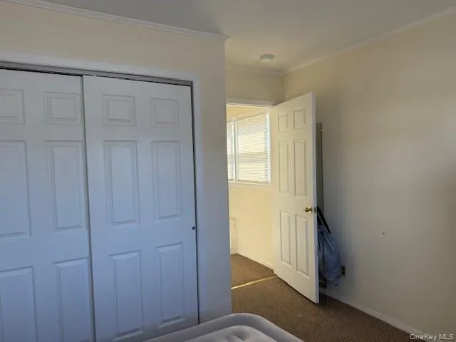 a view of staircase with lots of frames on wall