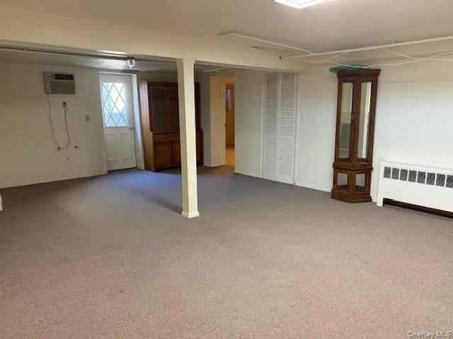 an empty room with a empty space and windows