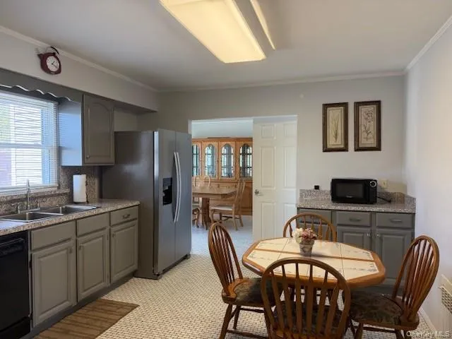 a view of a dining room with furniture and window
