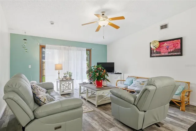 a bathroom with a sink a light fixture and a mirror