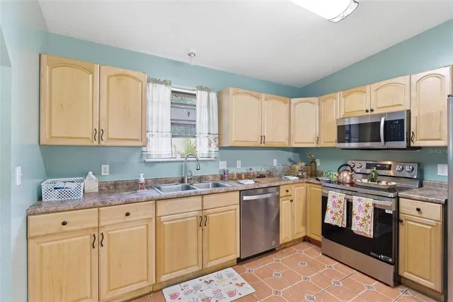 a living room with furniture chandelier and a chandelier