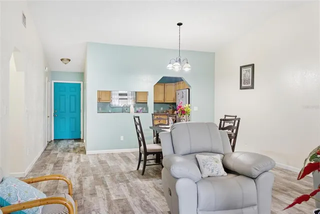 a dining room with furniture and window