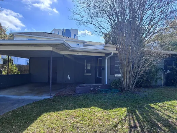 a view of a house with a yard
