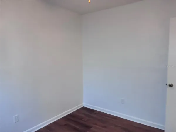 a view of a small space with wooden floor