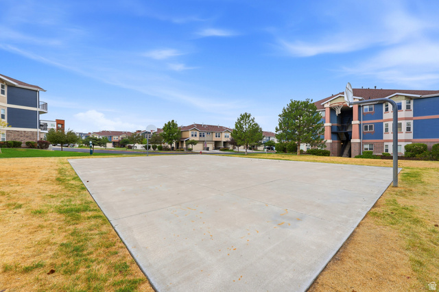 116 East Resaca Drive, Unit F6 Sandy, UT 84070 - Photo 29 of 32 Outdoor concrete court with a basketball hoop